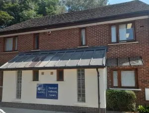 The photo shows the outside of our Nightlight Crisis House, with visible windows and a roof